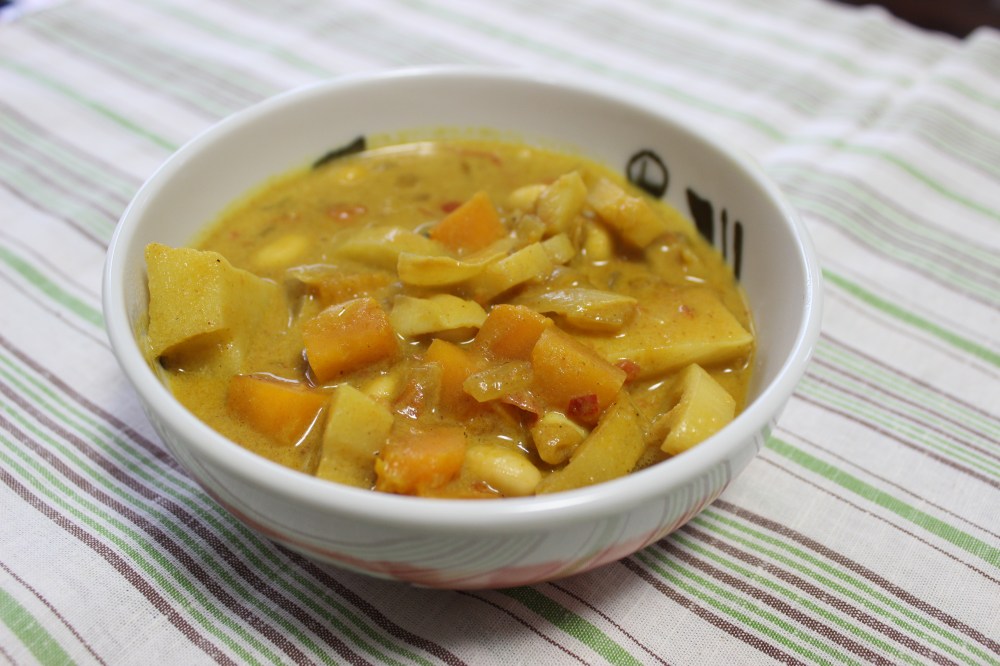 A bowl of Bamboo Coconut Curry with Kabocha, Lotus Root, and Soybeans