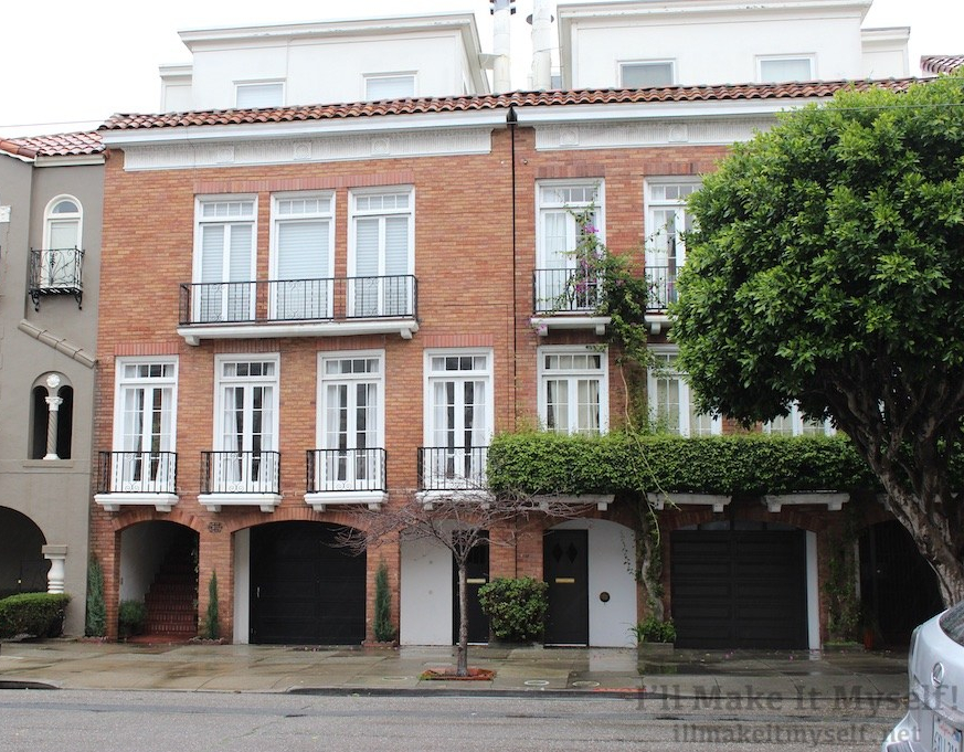 Image of a brick townhouse with French windows