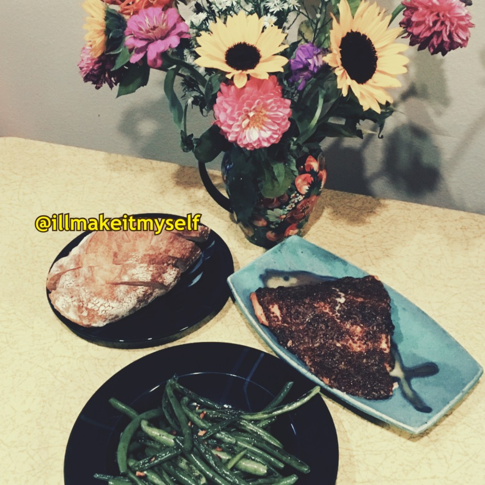 Roasted Salmon with Mustard and Herbs, served with bread (before the low-carb diet) and green beans. There is a vase of sunflowers and dahlias on the table.