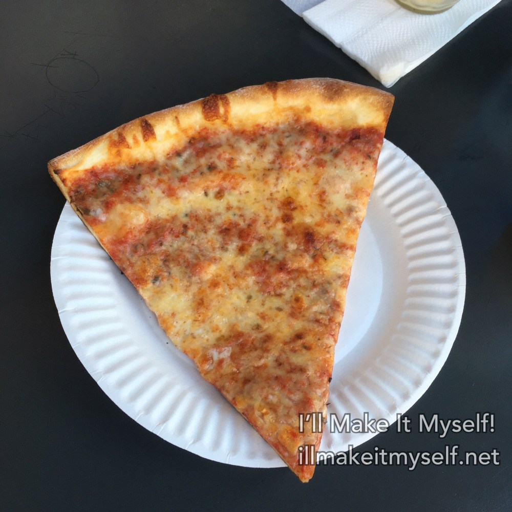 A slice of cheese pizza from Pizza Zone on paper plate.